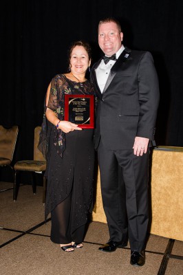 Eileen Rodriguez, Regional Director for the Florida SBDC at USF, accepts the Florida SBDC Network Florida Best Practice Award from Michael Myhre