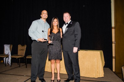 (L-R): Jairo Batista and Marice Hague accept the Florida SBDC Network Florida Employee of the Year Award from Michael Myhre