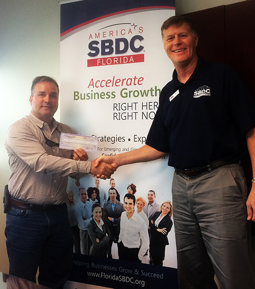 Joseph Welbourn (left), Owner of Carbon Marine, worked with the Florida SBDC at USF to secure an emergency bridge loan for the business following Hurricane Irma.